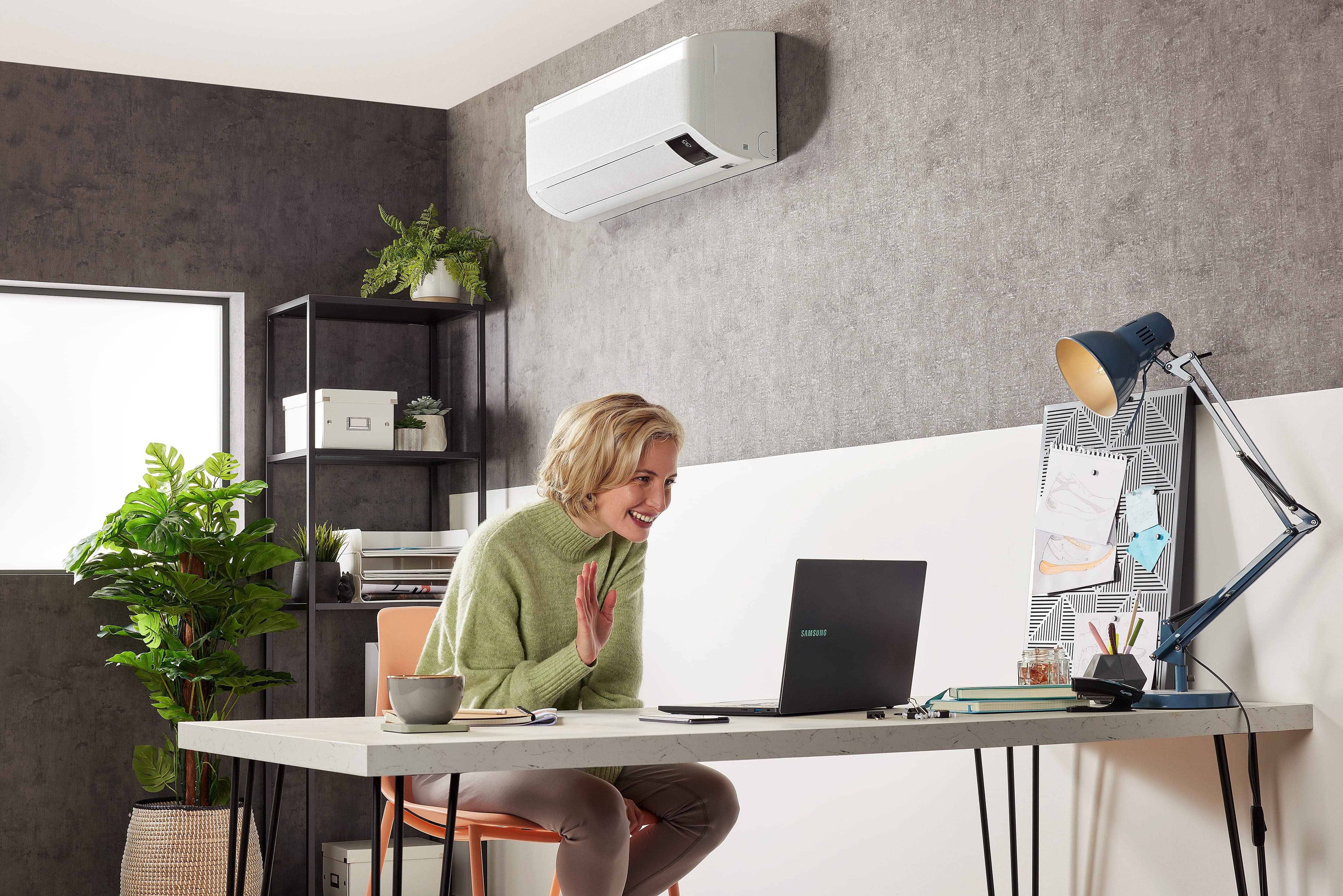 Wall-mounted air conditioner in a calm bedroom